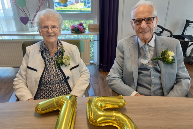 Het echtpaar samen op de foto