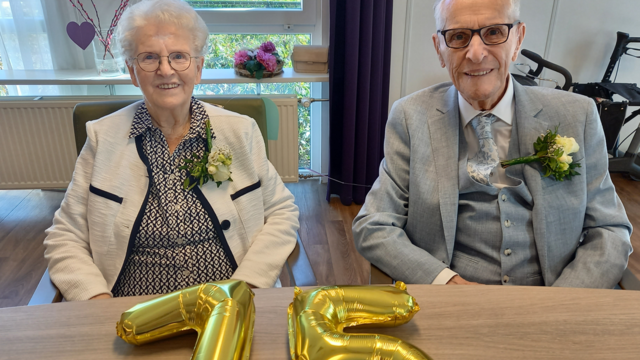 Het echtpaar samen op de foto